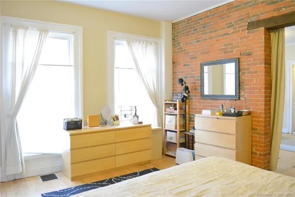 a room with bed and window
