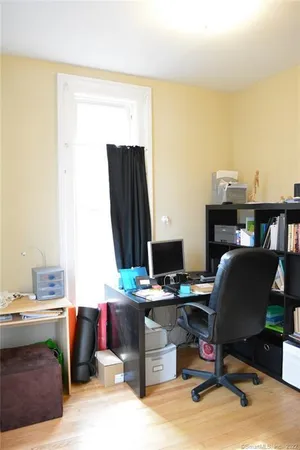 a room with furniture and a wooden floor