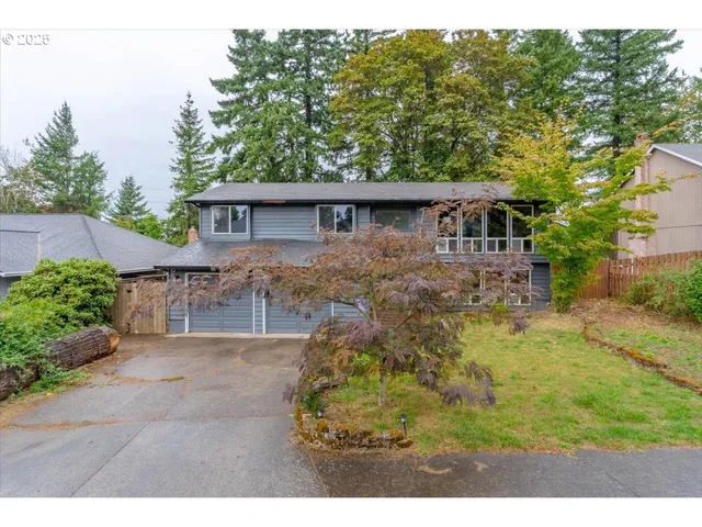 a backyard of a house with yard and outdoor seating