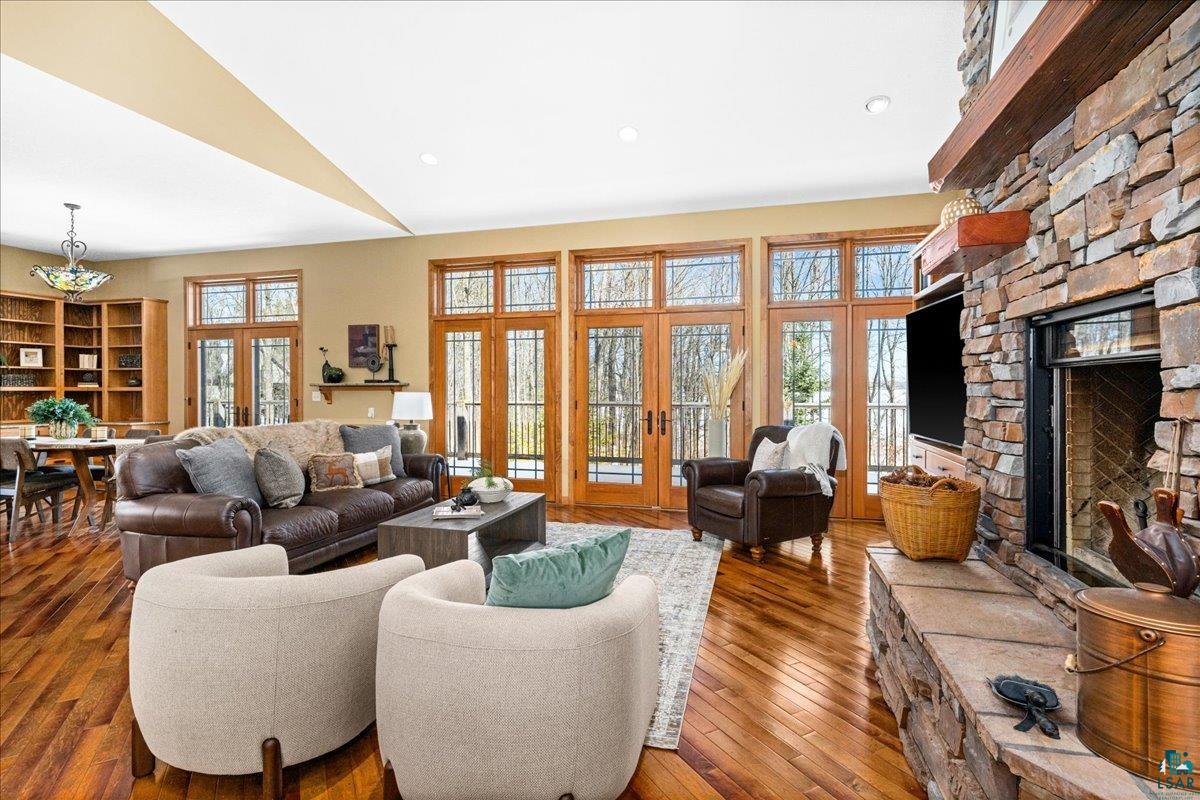 92598 Spells Road Sturgeon Lake, MN 55783 - Photo 14 of 60 Living room with a fireplace, hardwood / wood-style flooring, french doors, and recessed lighting