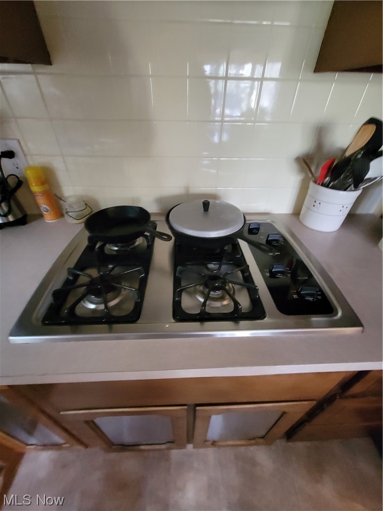 5759 Rhodes Road Kent, OH 44240 - Photo 19 of 29 Gas cooktop and double ovens in kitchen