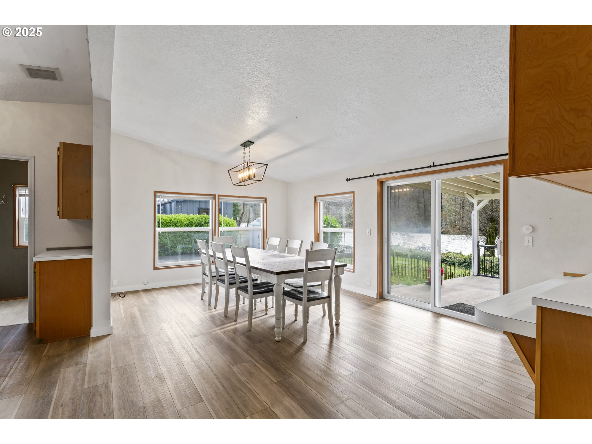 47520 Perkins Street Oakridge, OR 97463 - Photo 21 of 44 a view of a dining room with furniture and wooden floor