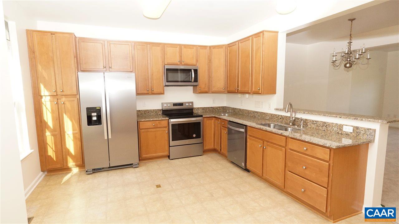 461 Rolkin Road Charlottesville, VA 22911 - Photo 3 of 19 a kitchen with stainless steel appliances granite countertop a stove a sink and a refrigerator