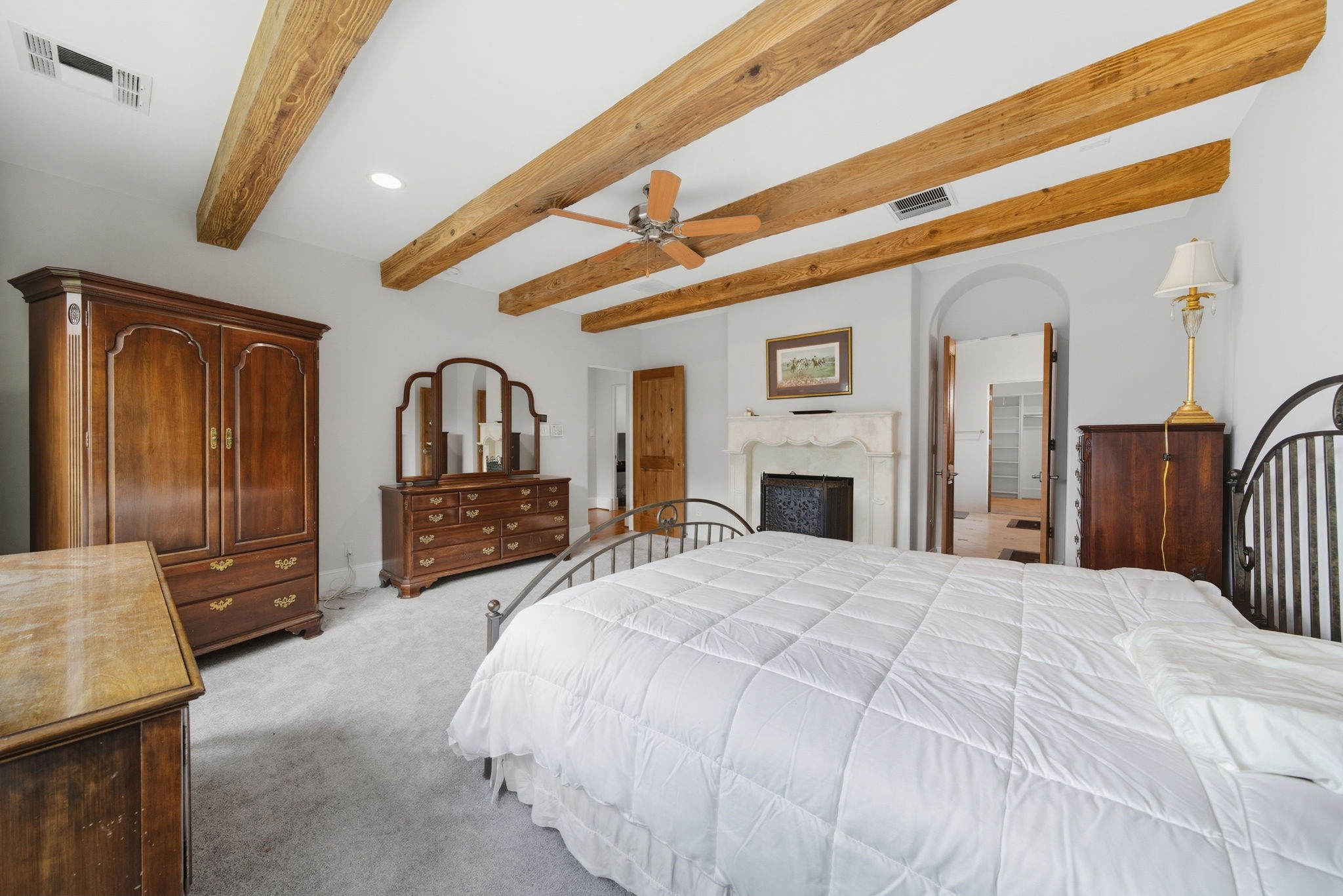 2370 Bolsover Street Houston, TX 77005 - Photo 24 of 46 a large bed sitting in a spacious bedroom and a dresser