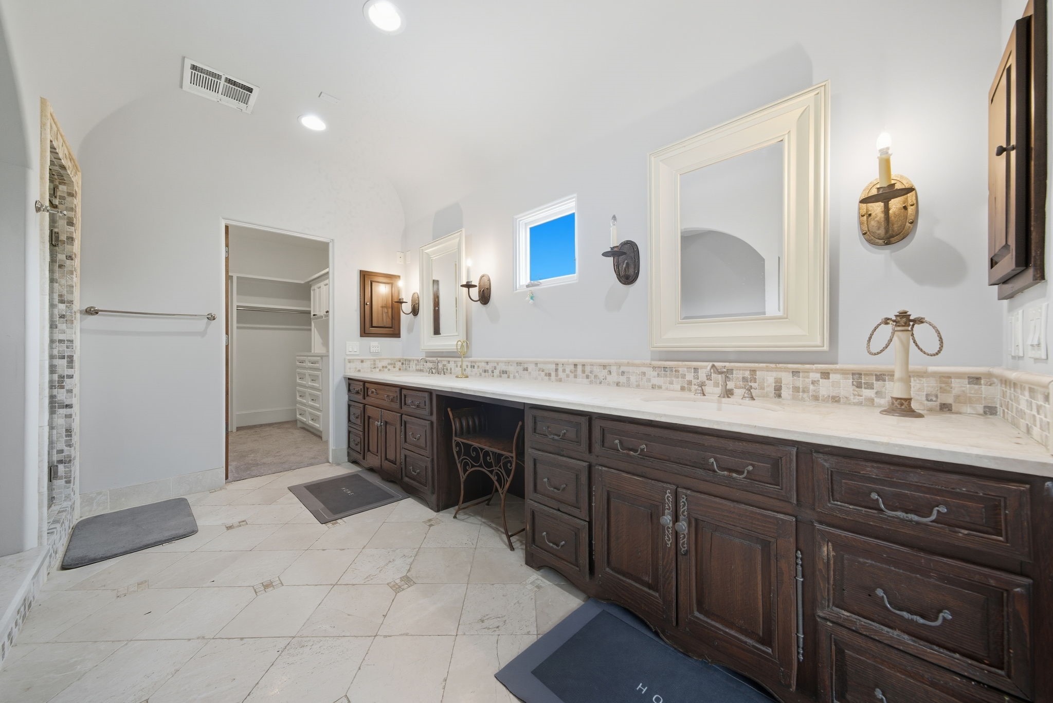 2370 Bolsover Street Houston, TX 77005 - Photo 25 of 46 a spacious bathroom with a granite countertop sink and a mirror