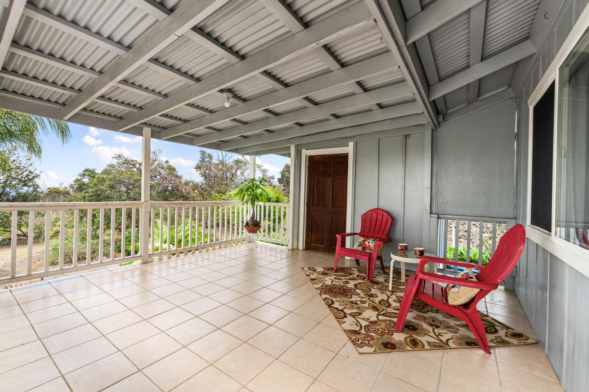 92-8583 Paradise Parkway Ocean View, HI 96704 - Photo 14 of 28 a view of a chairs and table in the balcony