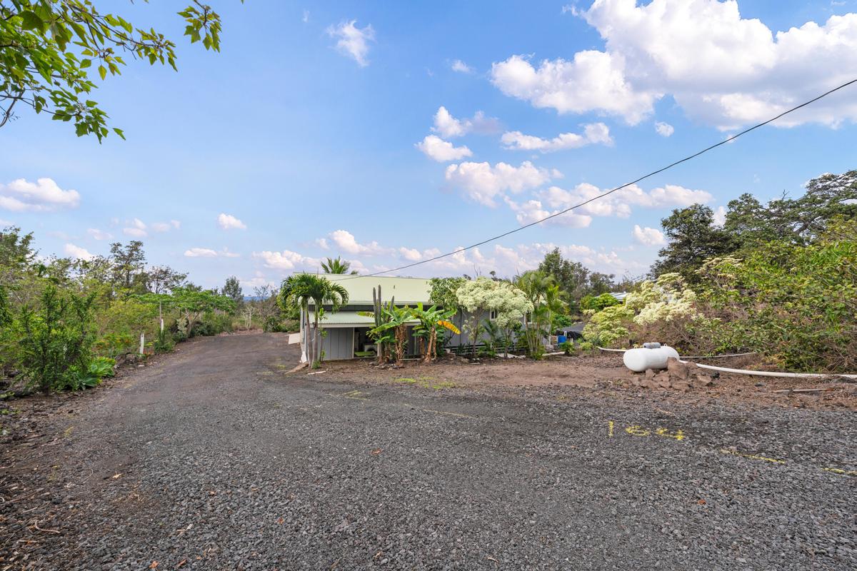 92-8583 Paradise Parkway Ocean View, HI 96704 - Photo 20 of 28 a view of a field with some trees