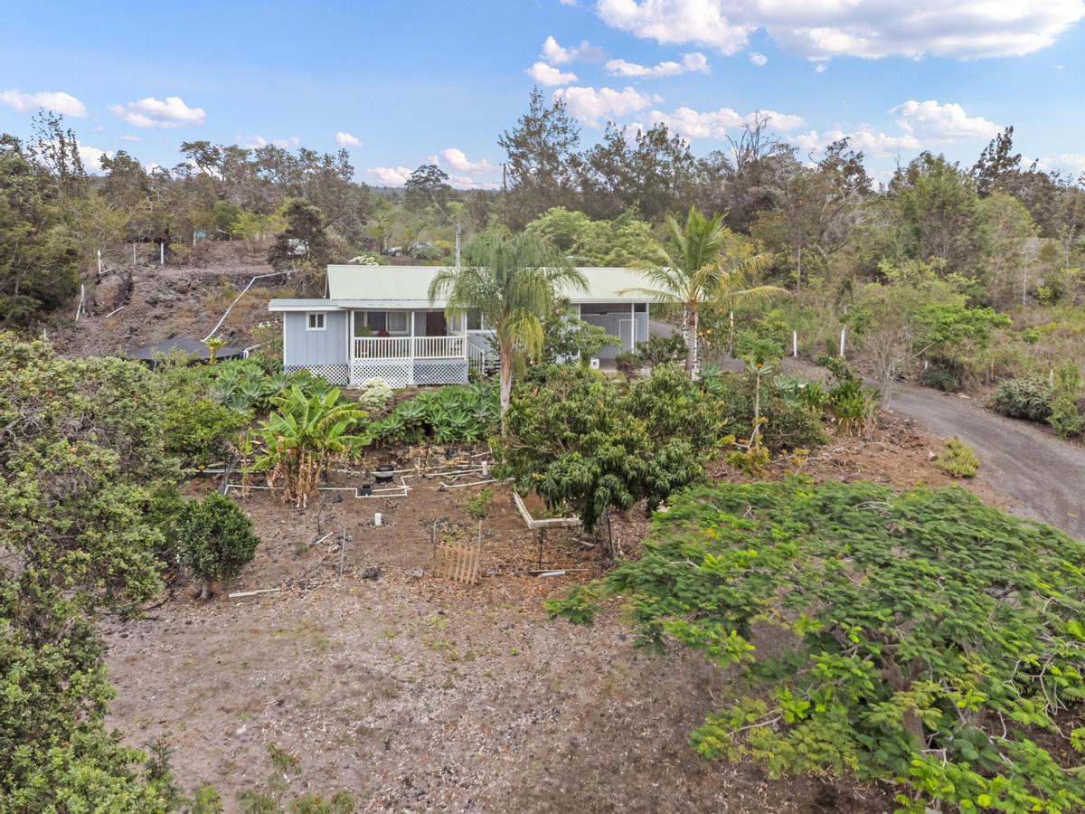 92-8583 Paradise Parkway Ocean View, HI 96704 - Photo 23 of 28 a view of a big yard with large trees