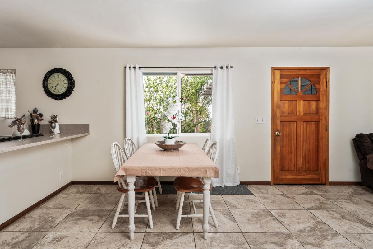 92-8583 Paradise Parkway Ocean View, HI 96704 - Photo 6 of 28 a dining room with furniture and window