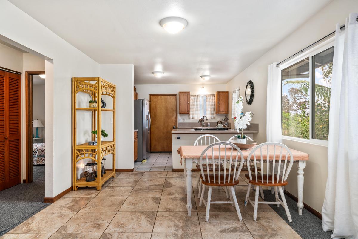 92-8583 Paradise Parkway Ocean View, HI 96704 - Photo 7 of 28 a view of a dining room with furniture window and outside view