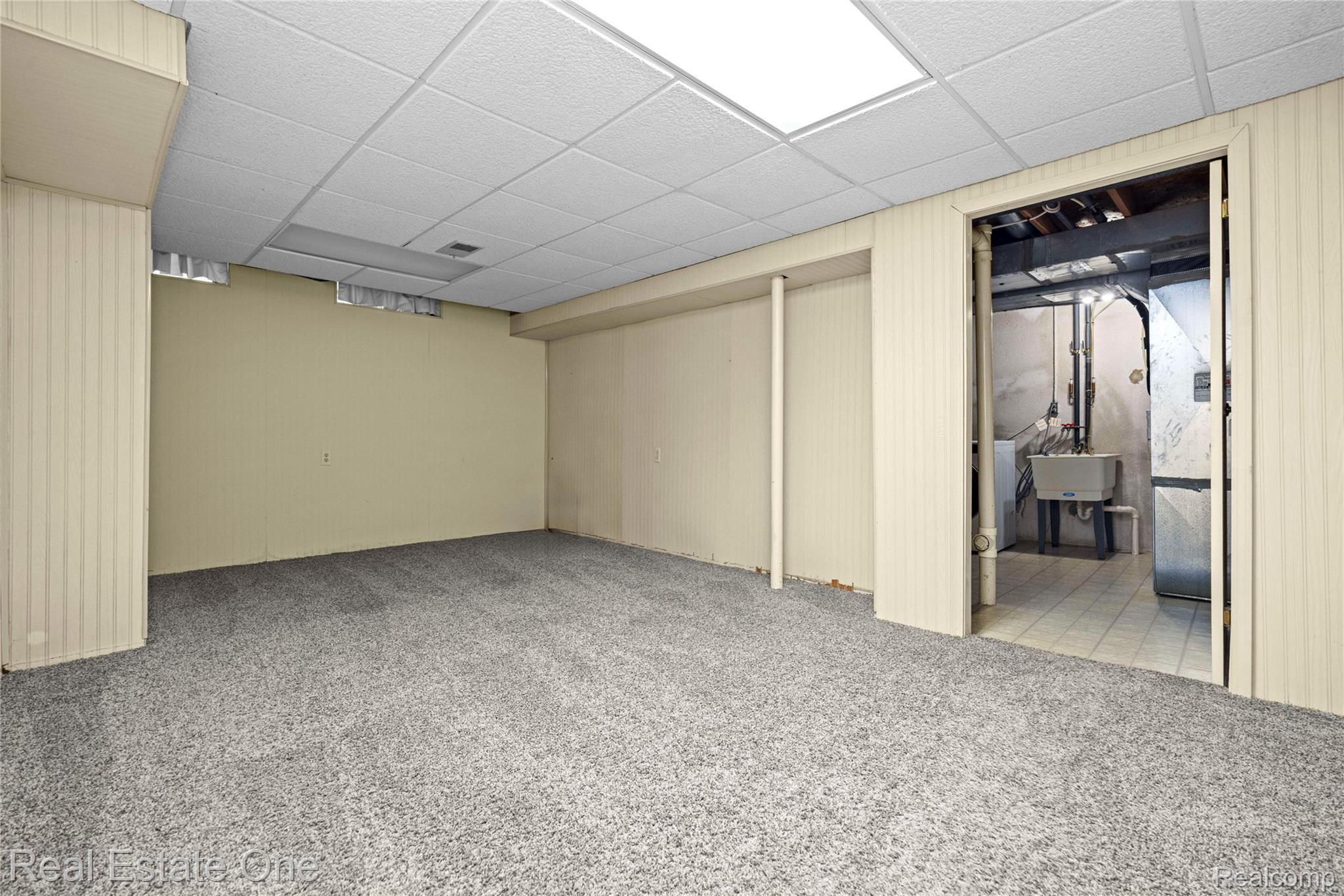 39750 Cheviot Road Canton, MI 48188 - Photo 52 of 71 Finished room featuring textured wall panels, carpet flooring, and recessed ceiling lighting