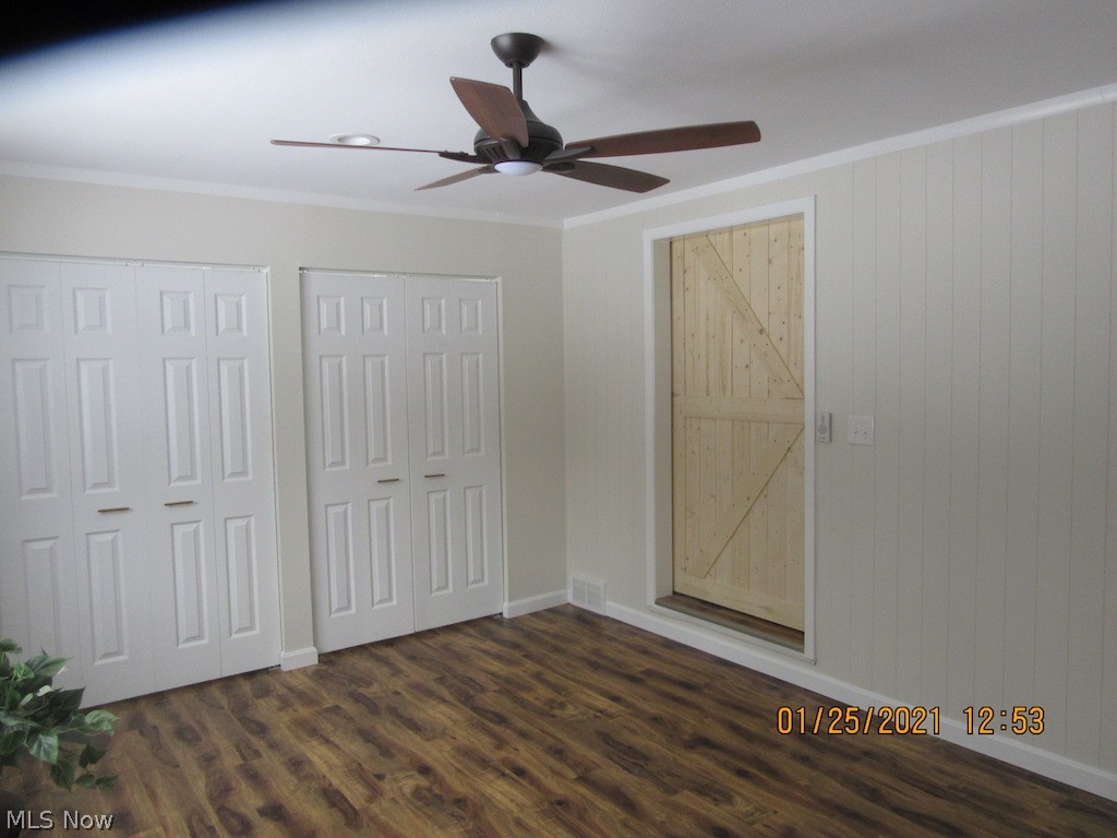 3749 Blackmore Road Perry, OH 44081 - Photo 12 of 25 master bedroom w/ premier vinyl plank flooring, pine barn door, ceiling fan and fresh paint.