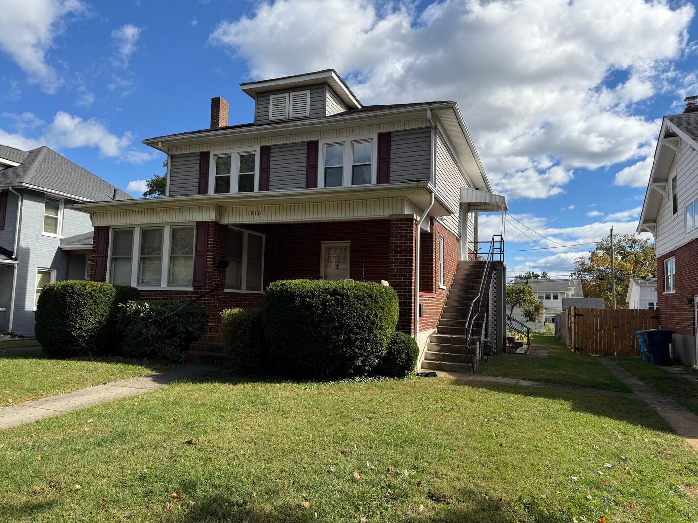 1912 Arden Road Southwest Roanoke, VA 24015 - Photo 1 of 19 a front view of a house with a garden