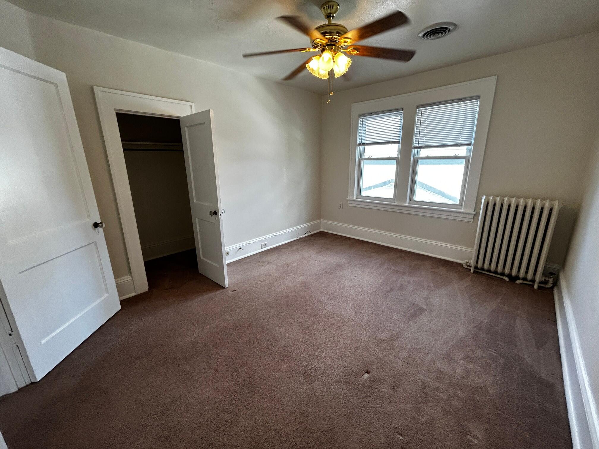 1912 Arden Road Southwest Roanoke, VA 24015 - Photo 14 of 19 an empty room with windows and fan