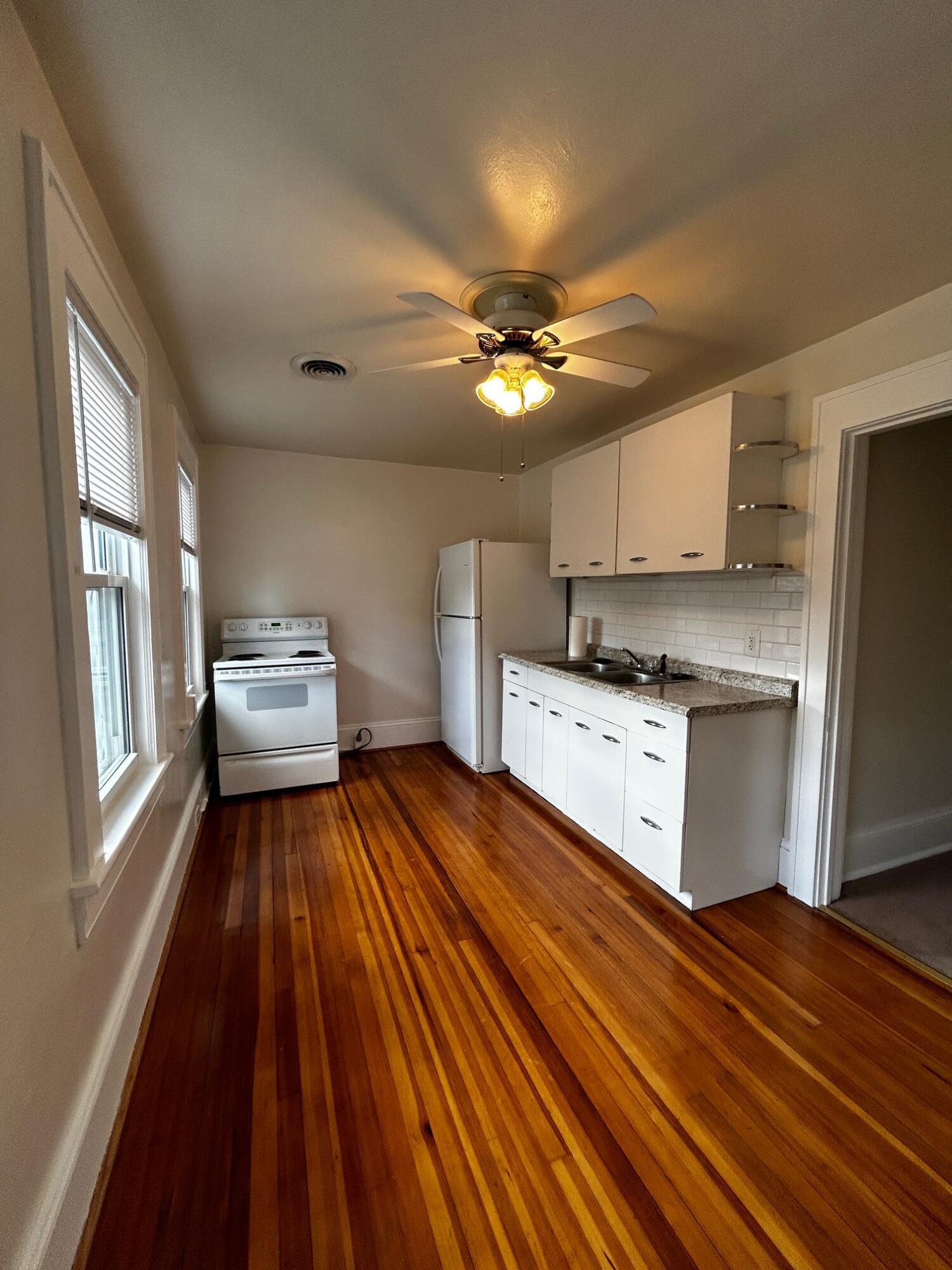 1912 Arden Road Southwest Roanoke, VA 24015 - Photo 15 of 19 a kitchen with kitchen island white cabinets and stainless steel appliances