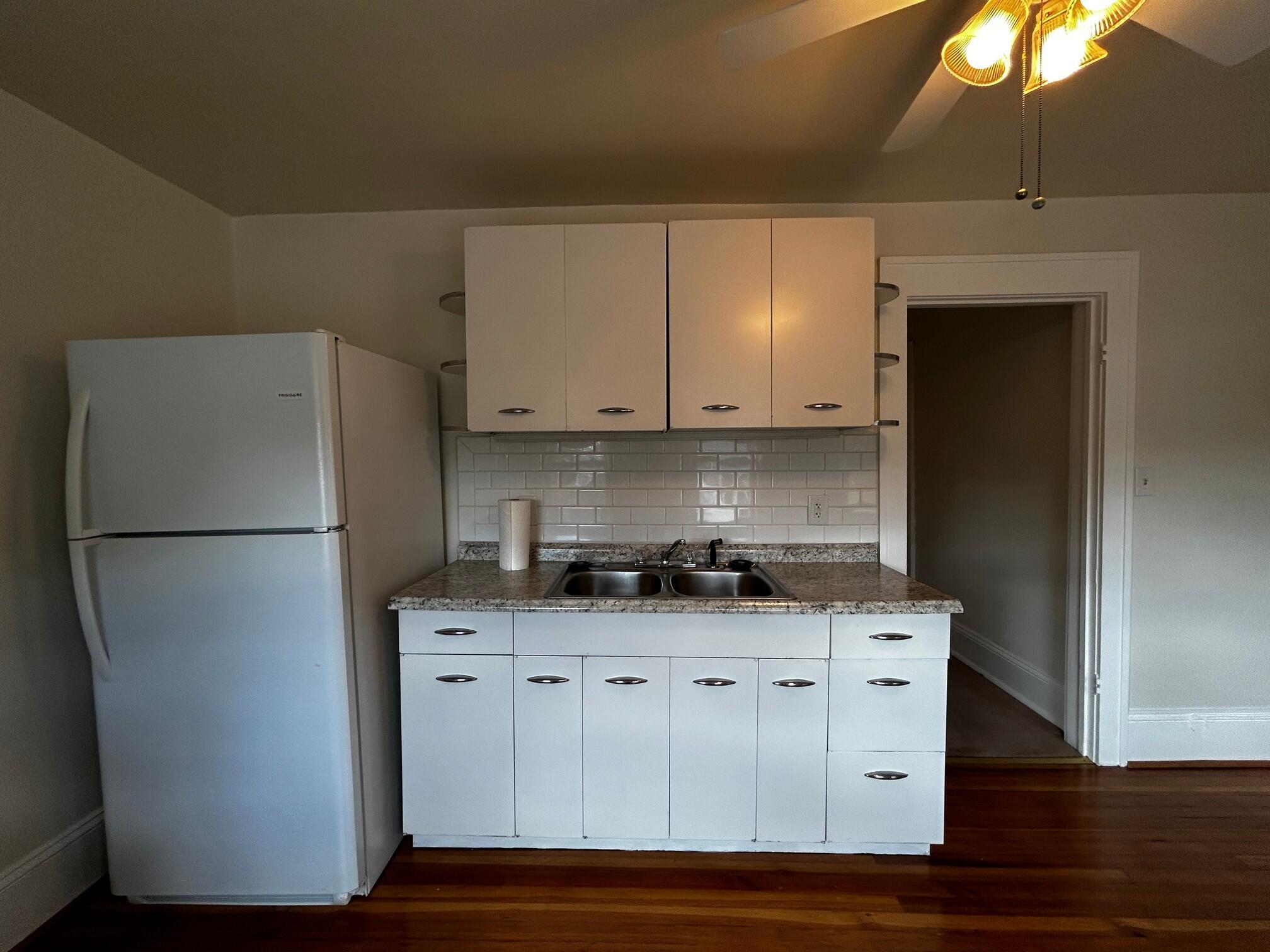 1912 Arden Road Southwest Roanoke, VA 24015 - Photo 16 of 19 a white refrigerator freezer sitting inside of a kitchen