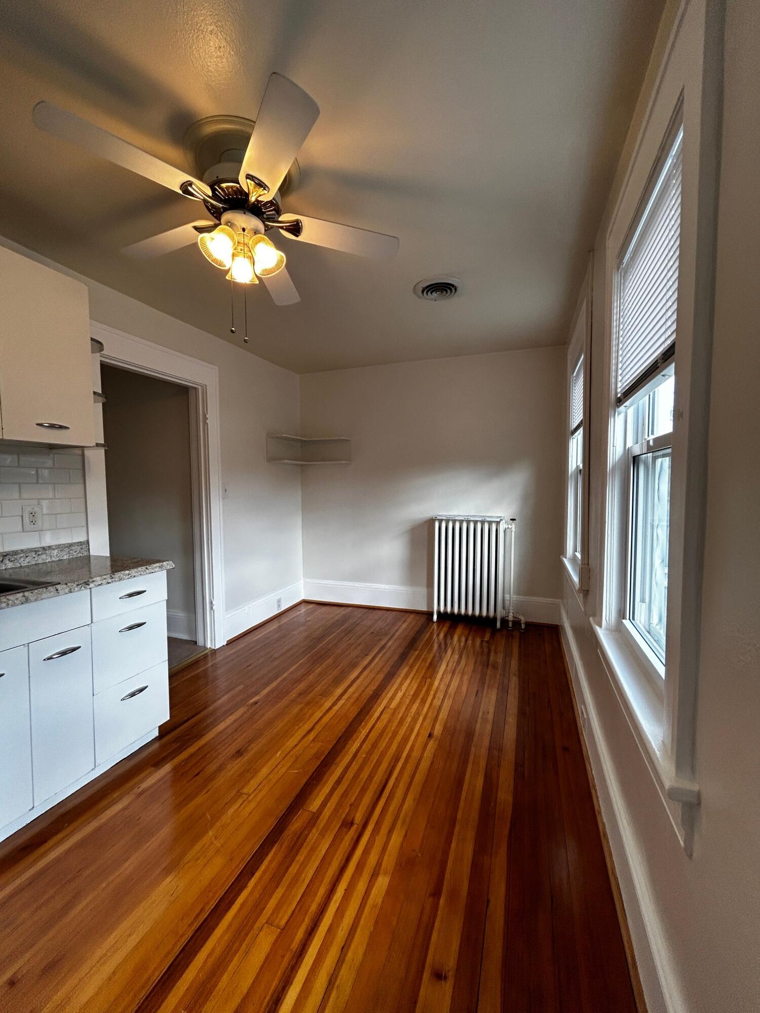 1912 Arden Road Southwest Roanoke, VA 24015 - Photo 17 of 19 a view of an empty room and window with wooden floor