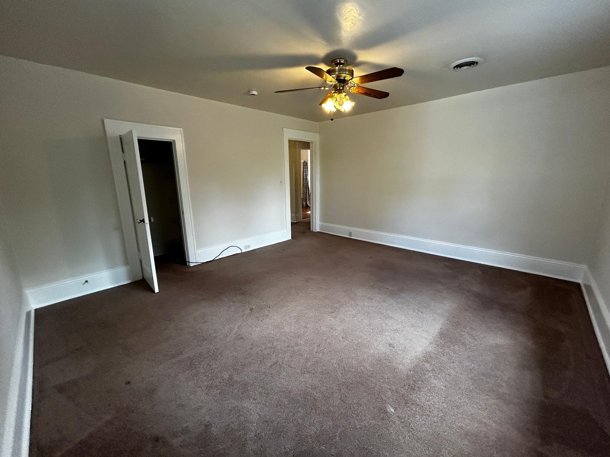 1912 Arden Road Southwest Roanoke, VA 24015 - Photo 10 of 19 a view of an empty room with a chandelier fan