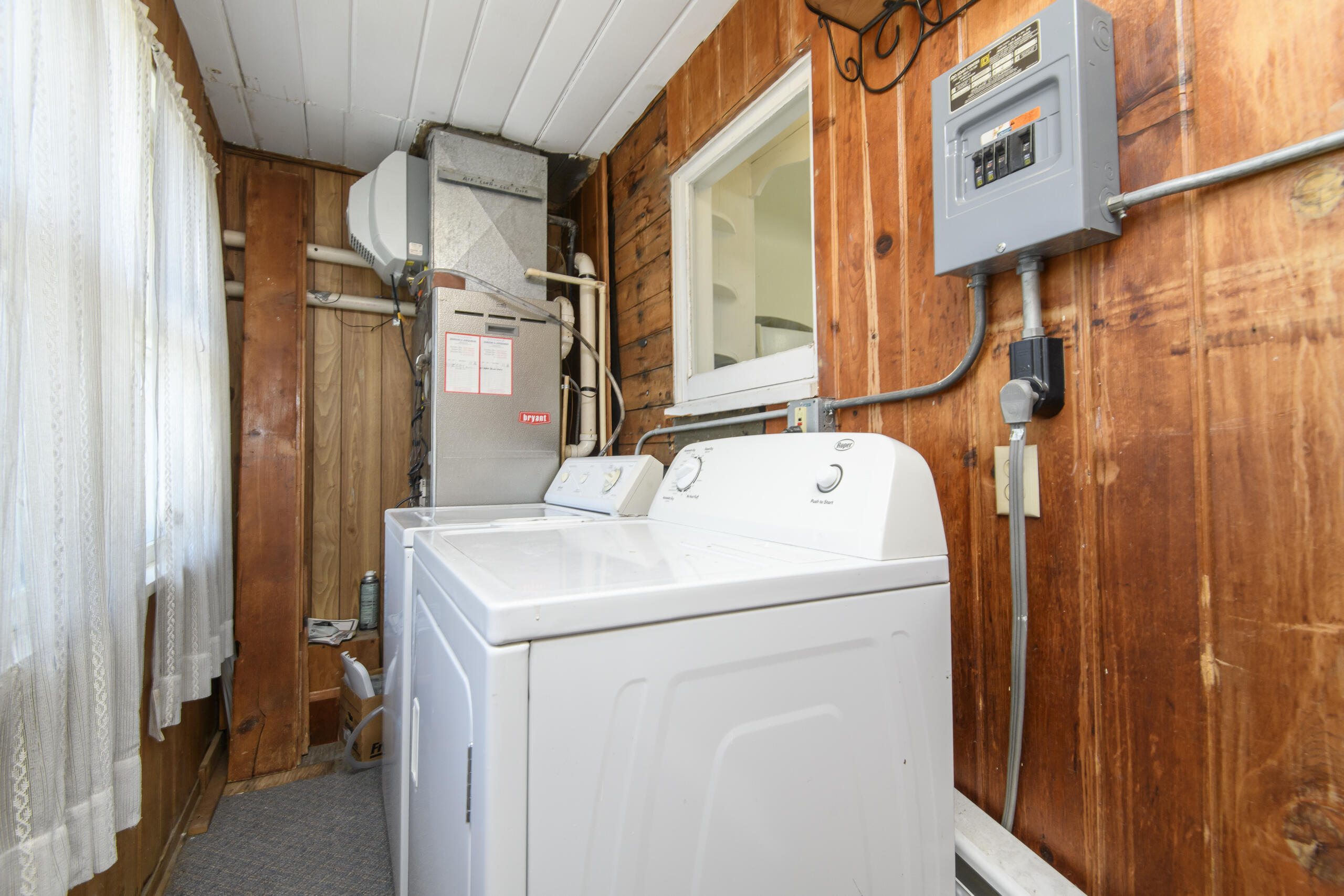 3554 South 84th Street, Unit 3554A Milwaukee, WI 53228 - Photo 14 of 27 Upper unit's furnace and washer and dryer is located in the enclosed porch