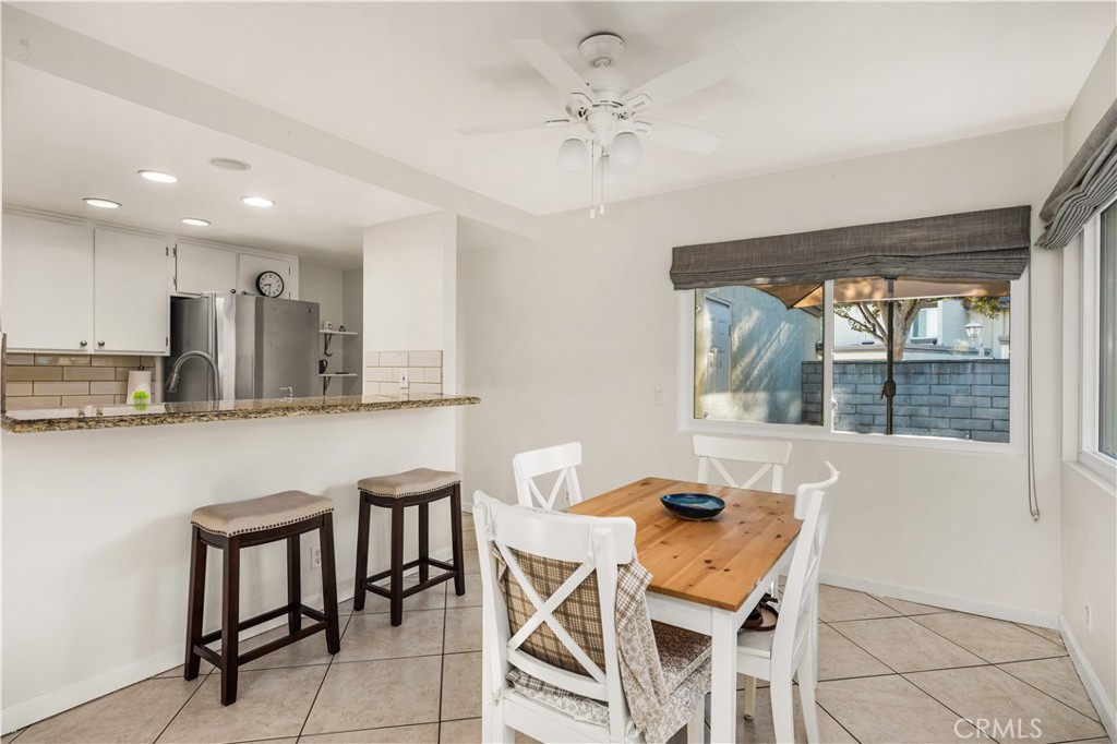5573 East Vista Del Rio Anaheim, CA 92807 - Photo 11 of 42 a view of a dining room with furniture and window