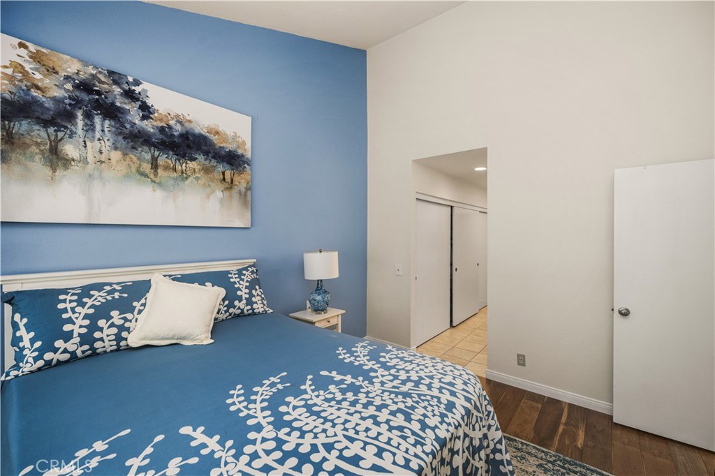 5573 East Vista Del Rio Anaheim, CA 92807 - Photo 20 of 42 a bedroom with a bed and a wall painting