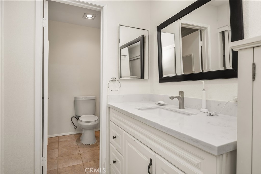 5573 East Vista Del Rio Anaheim, CA 92807 - Photo 22 of 42 a bathroom with a sink and a toilet