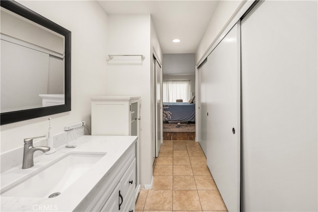 5573 East Vista Del Rio Anaheim, CA 92807 - Photo 24 of 42 a bathroom with a sink and a mirror