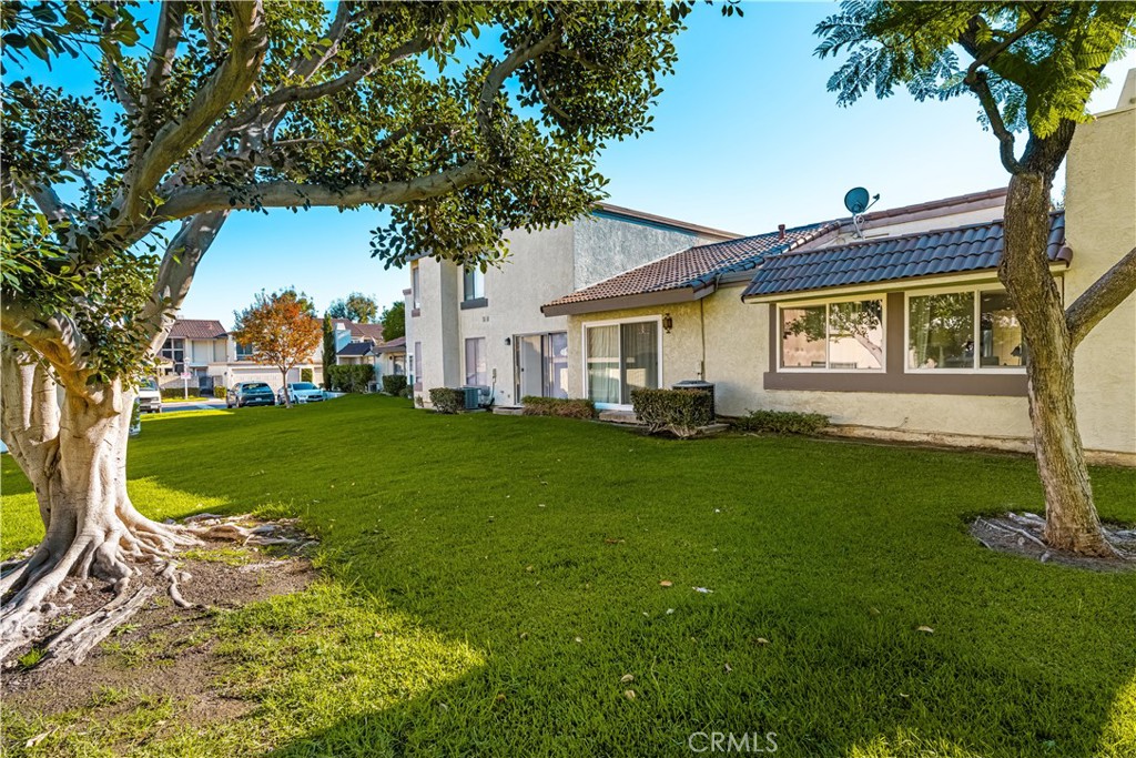 5573 East Vista Del Rio Anaheim, CA 92807 - Photo 29 of 42 a front view of a house with garden