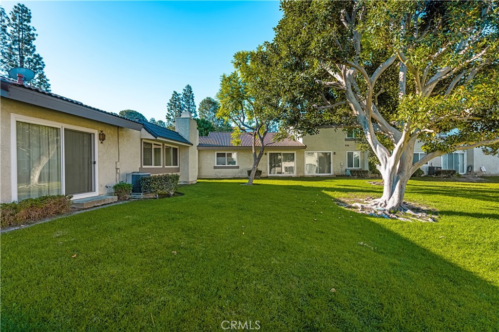 5573 East Vista Del Rio Anaheim, CA 92807 - Photo 30 of 42 a front view of house with yard