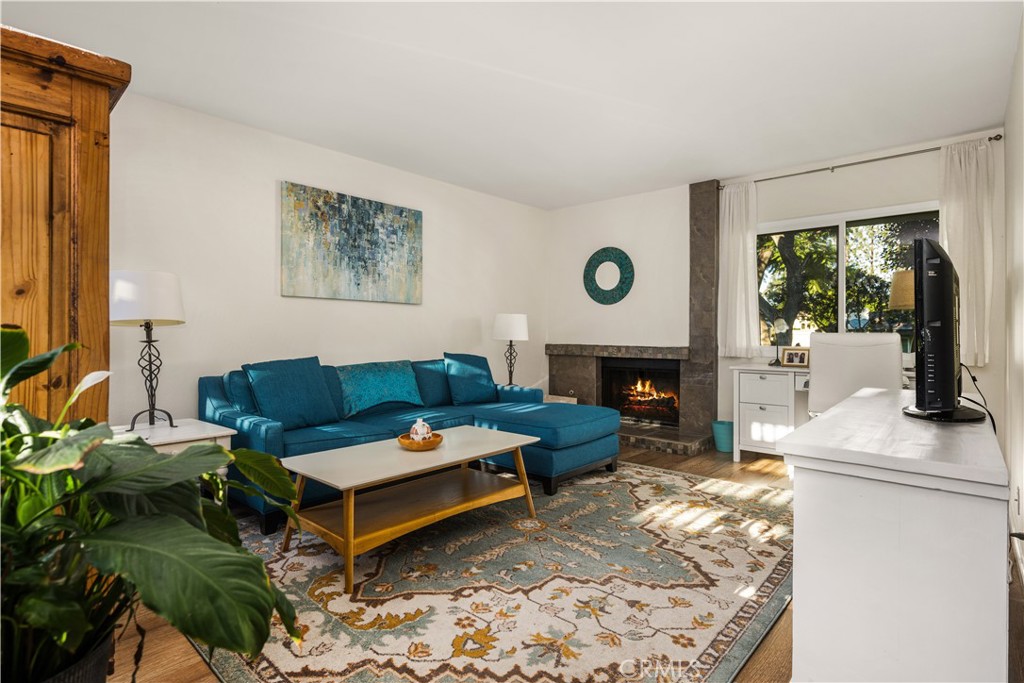 5573 East Vista Del Rio Anaheim, CA 92807 - Photo 6 of 42 a living room with furniture fireplace and window
