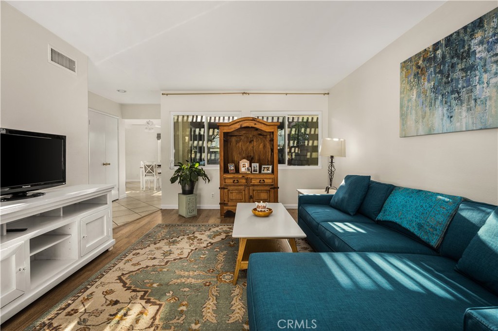 5573 East Vista Del Rio Anaheim, CA 92807 - Photo 9 of 42 a living room with furniture and a flat screen tv