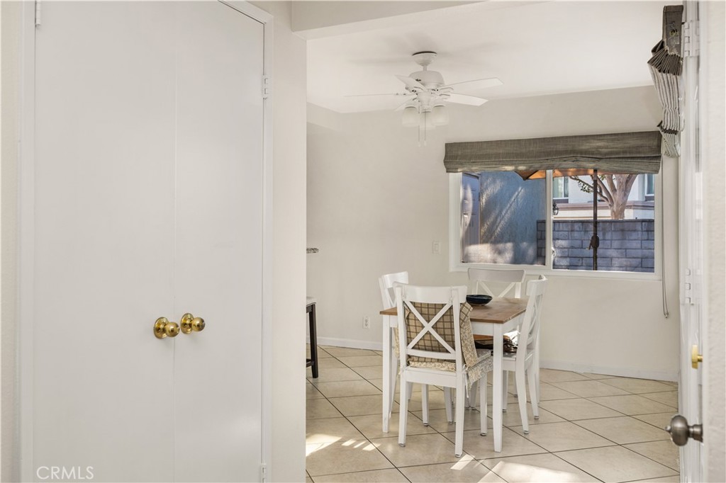 5573 East Vista Del Rio Anaheim, CA 92807 - Photo 10 of 42 a view of a dining room with furniture and chandelier