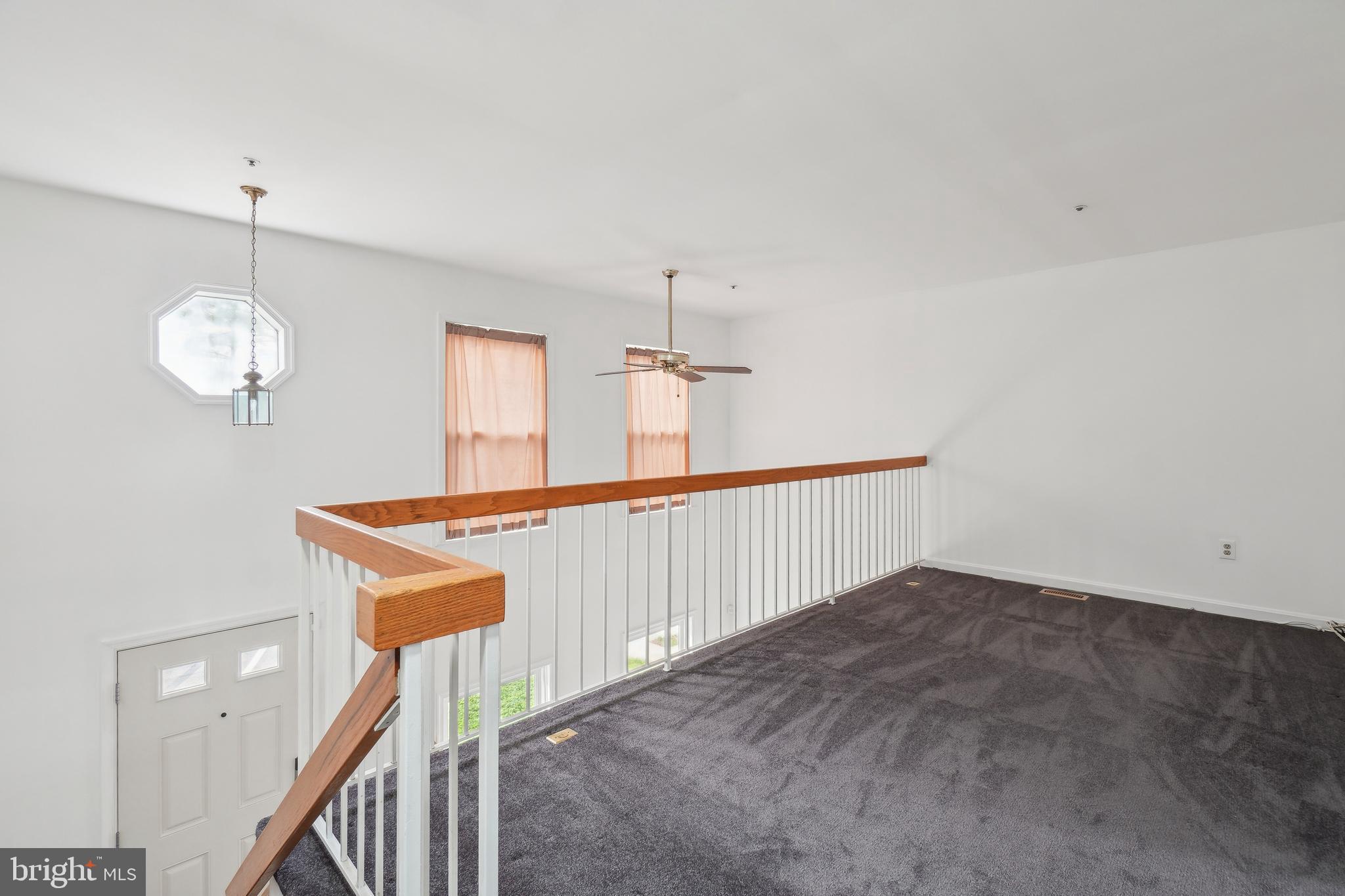 3425 Epic Gate Bowie, MD 20716 - Photo 11 of 25 a view of a hallway with a chandelier