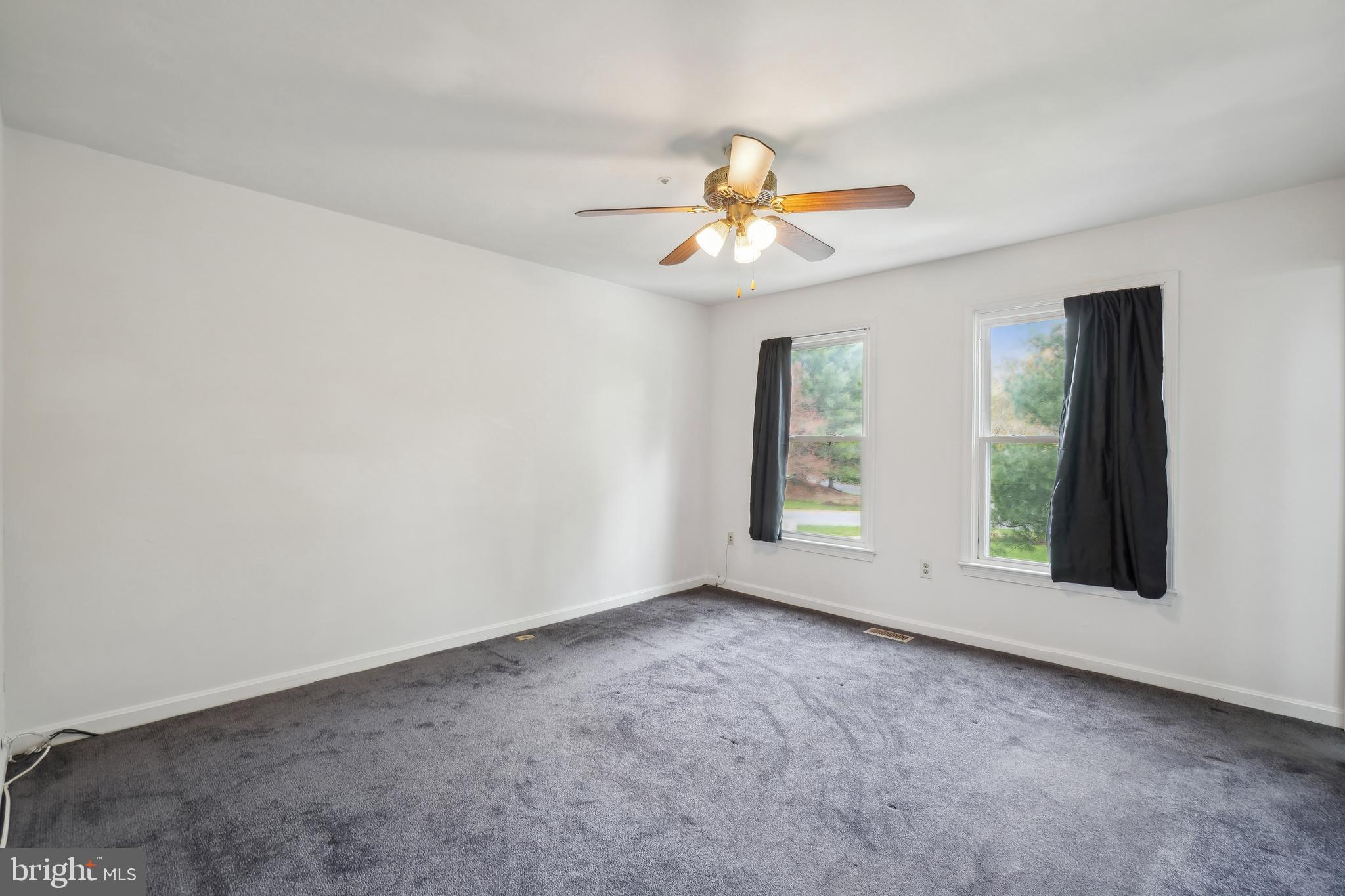 3425 Epic Gate Bowie, MD 20716 - Photo 13 of 25 an empty room with windows and fan