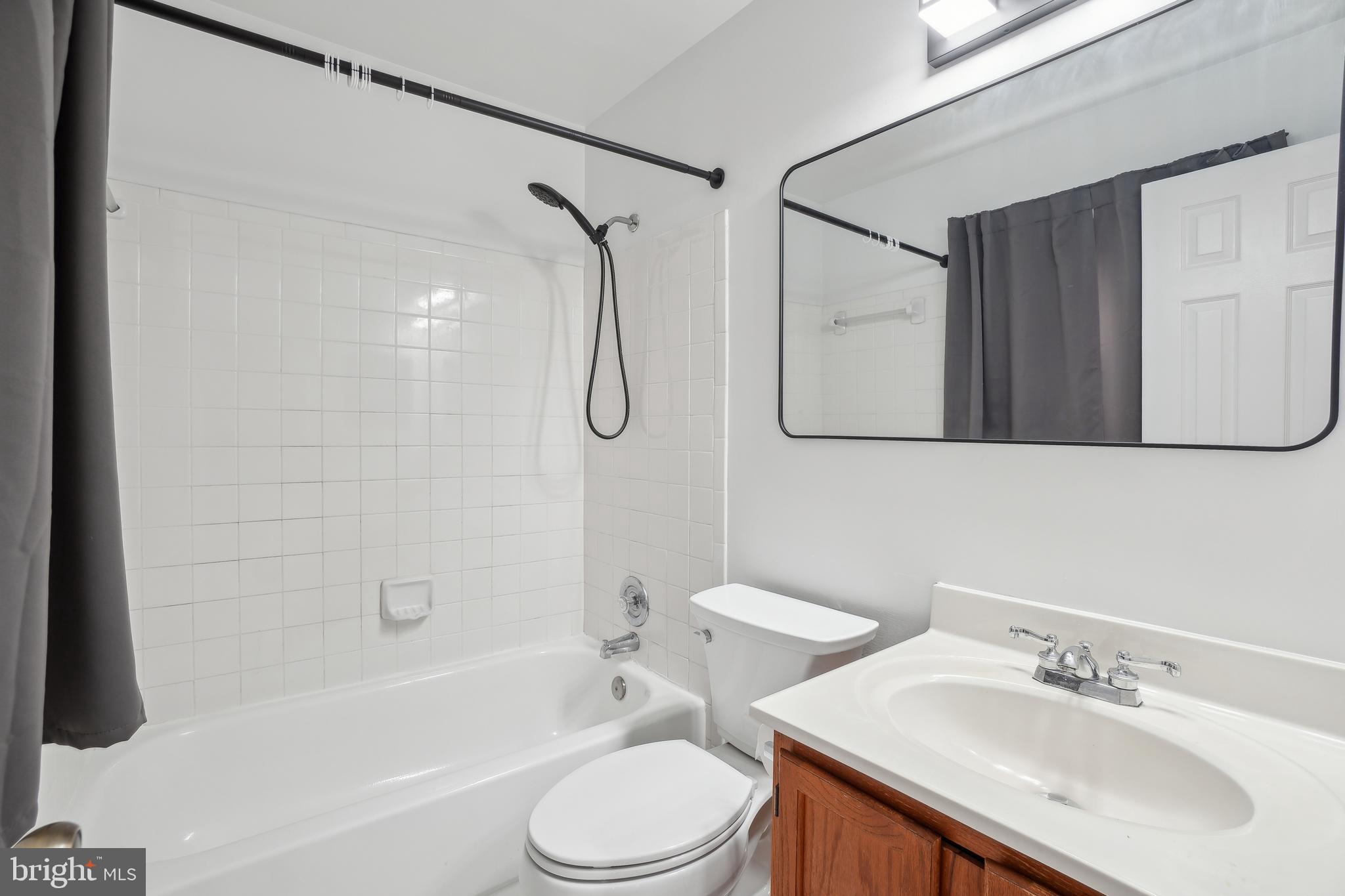 3425 Epic Gate Bowie, MD 20716 - Photo 14 of 25 a bathroom with a sink toilet and shower