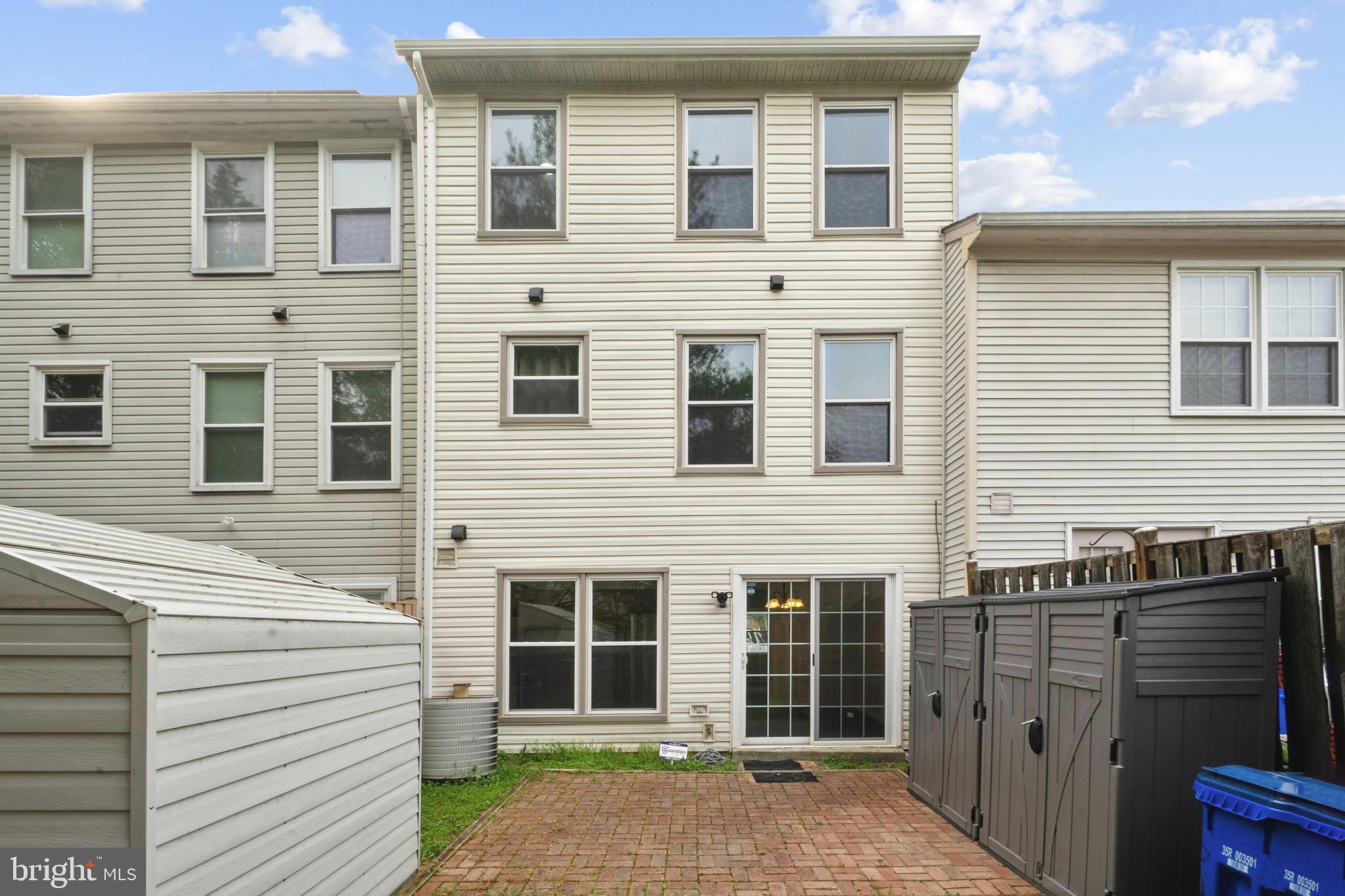 3425 Epic Gate Bowie, MD 20716 - Photo 22 of 25 a view of a house with a large window and wooden fence