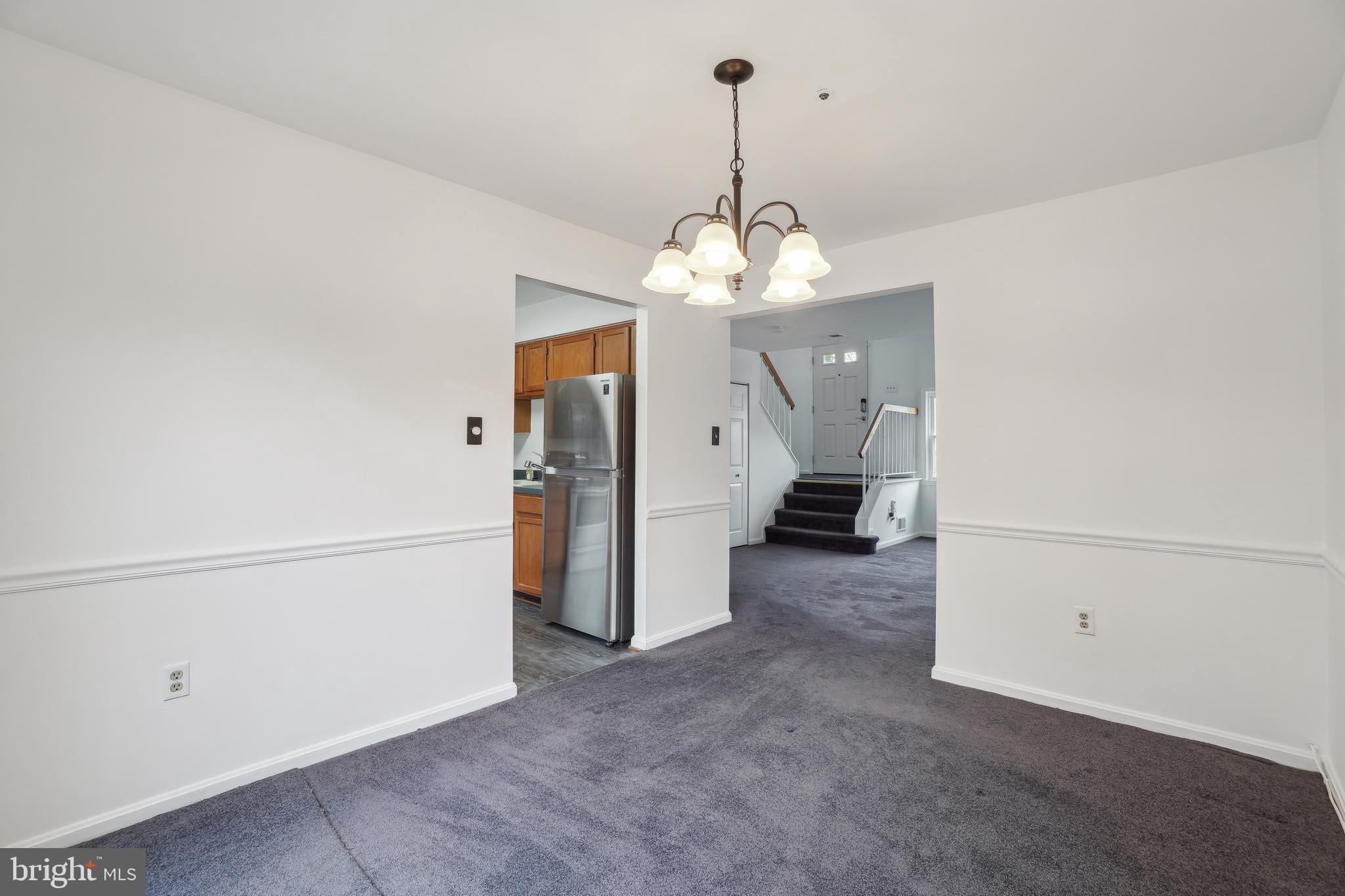 3425 Epic Gate Bowie, MD 20716 - Photo 6 of 25 a view of a livingroom with a chandelier