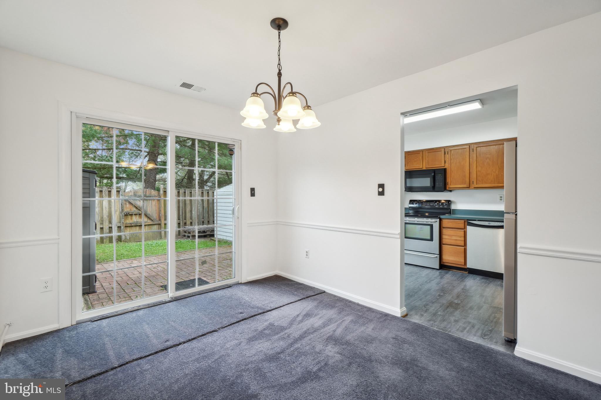 3425 Epic Gate Bowie, MD 20716 - Photo 7 of 25 a view of a kitchen with refrigerator and microwave