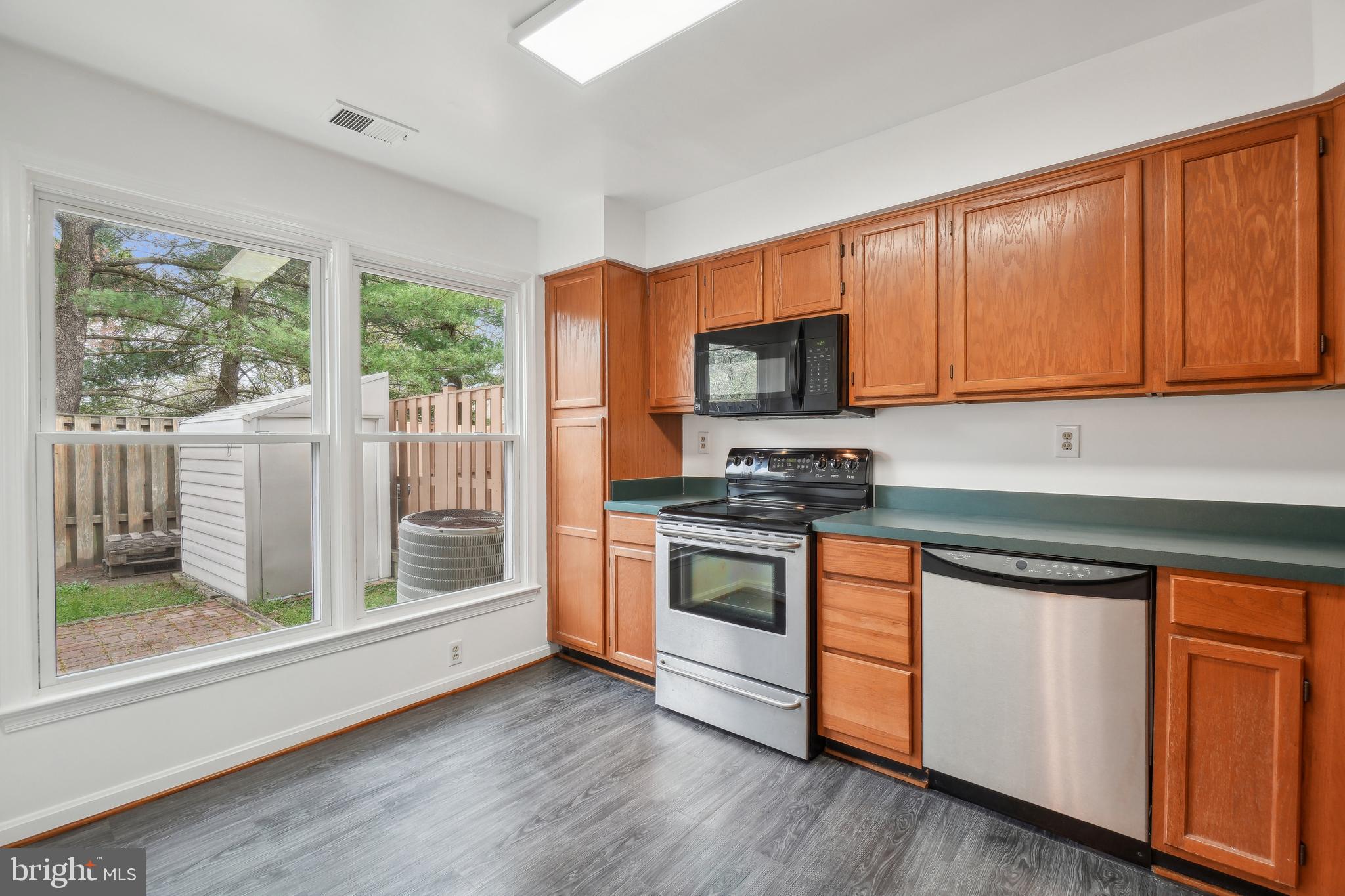 3425 Epic Gate Bowie, MD 20716 - Photo 8 of 25 a kitchen with stainless steel appliances granite countertop a stove a sink and a microwave