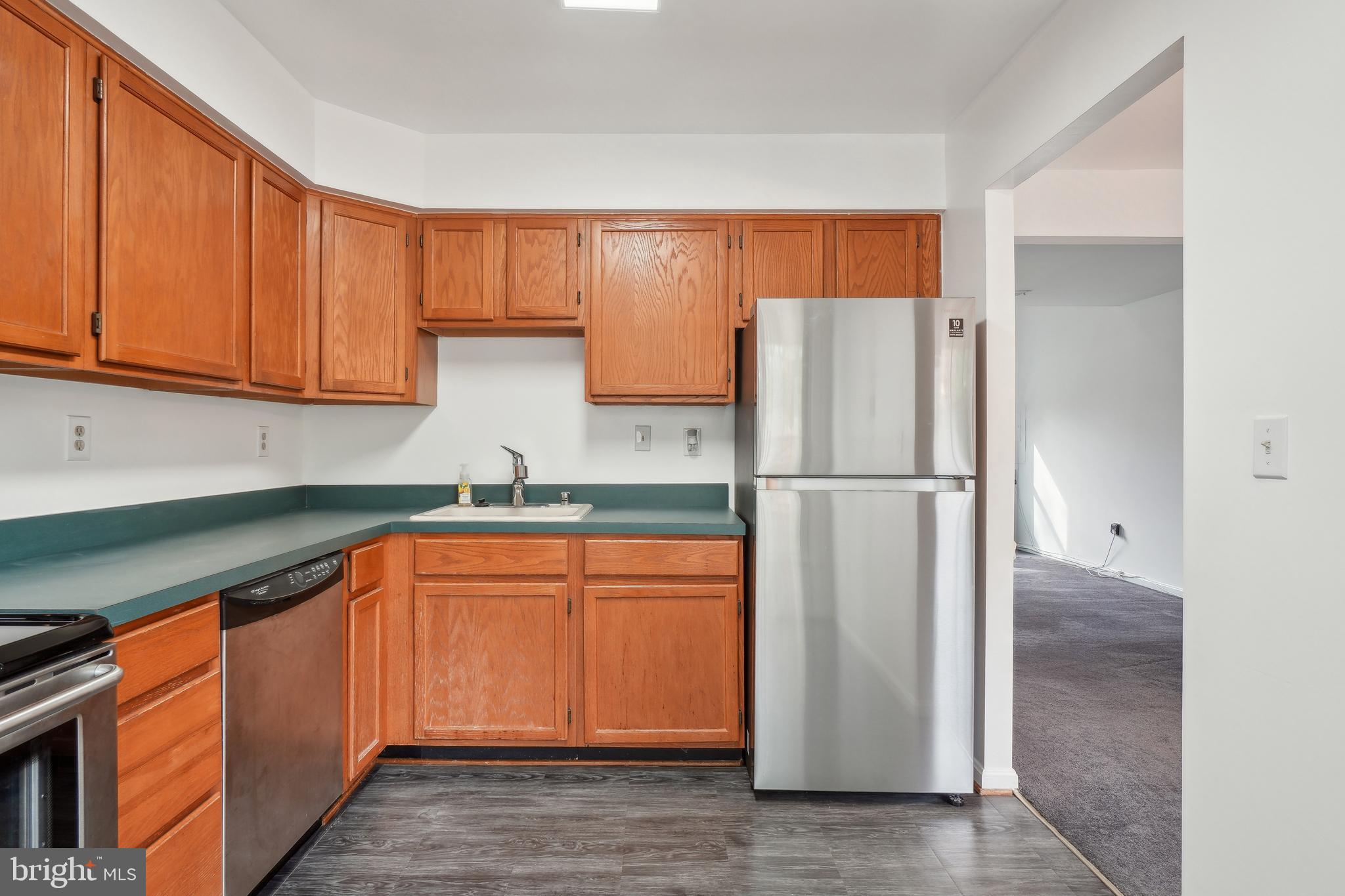 3425 Epic Gate Bowie, MD 20716 - Photo 10 of 25 a kitchen with stainless steel appliances granite countertop a refrigerator and a sink