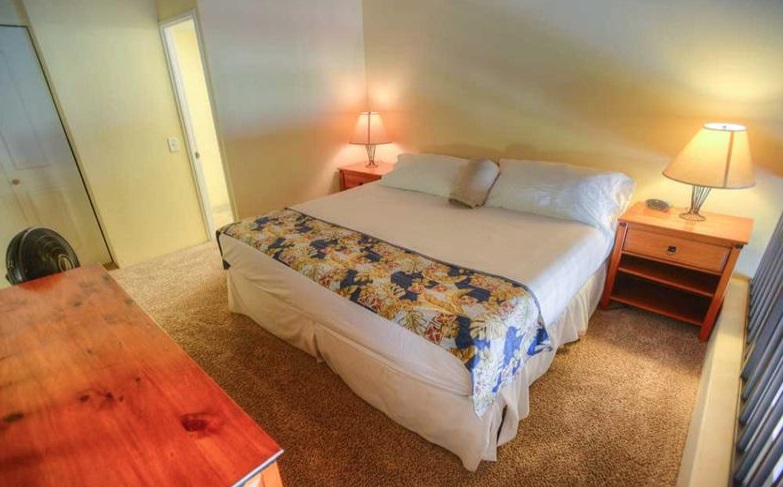 2191 South Kihei Road, Unit 2405 Kihei, HI 96753 - Photo 11 of 17 a bedroom with a bed and a night stand