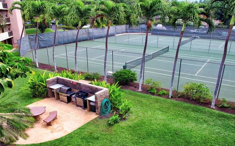 2191 South Kihei Road, Unit 2405 Kihei, HI 96753 - Photo 14 of 17 a backyard of a house with table and chairs