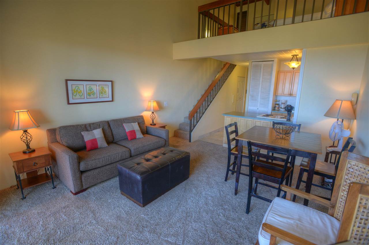2191 South Kihei Road, Unit 2405 Kihei, HI 96753 - Photo 4 of 17 a living room with furniture and a wooden floor