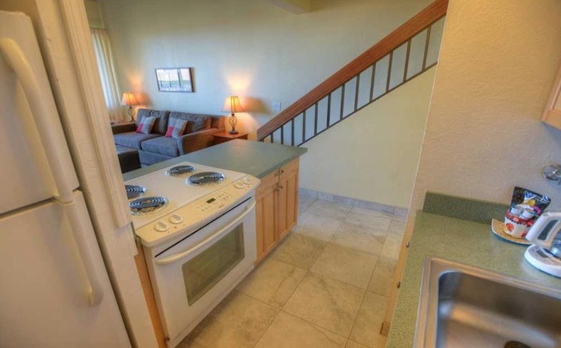 2191 South Kihei Road, Unit 2405 Kihei, HI 96753 - Photo 6 of 17 a utility room with dryer washer and a view of living room