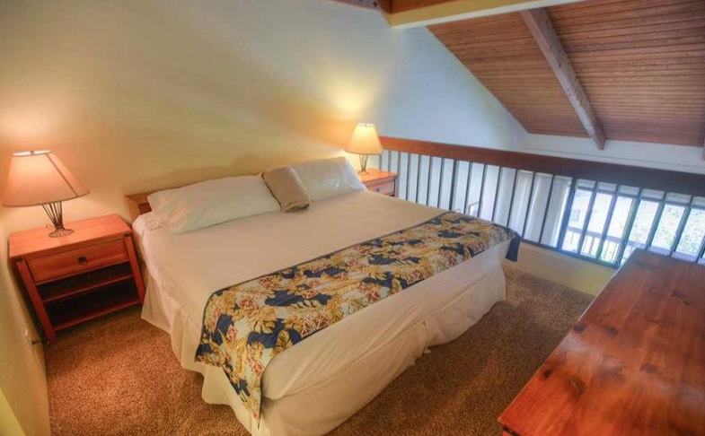 2191 South Kihei Road, Unit 2405 Kihei, HI 96753 - Photo 8 of 17 a bed sitting in a bedroom next to a window