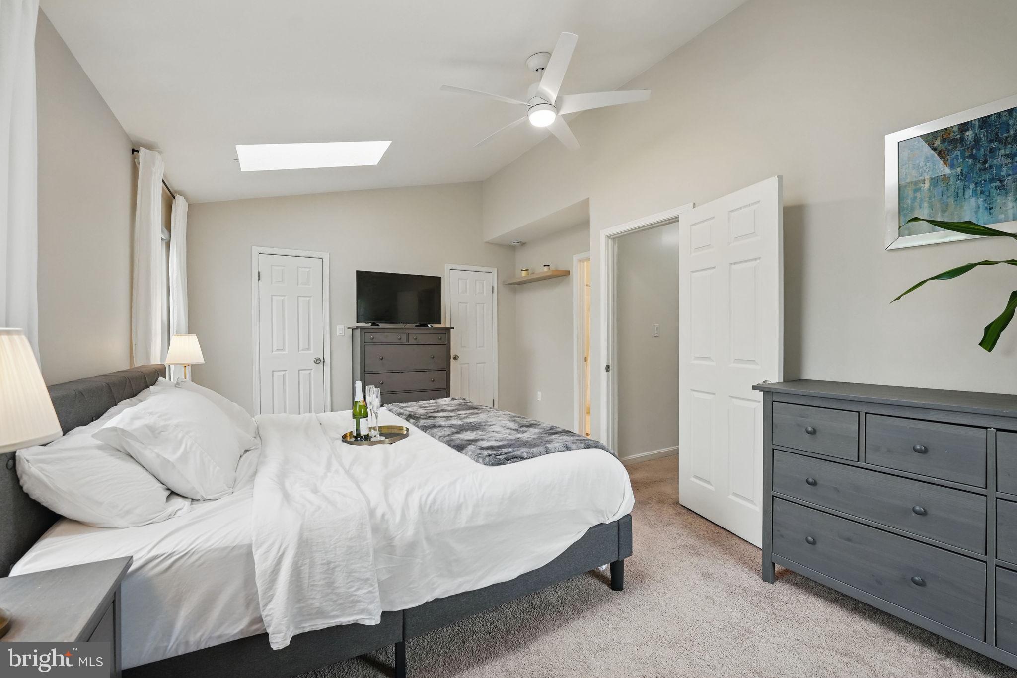 13121 Broadmore Road Silver Spring, MD 20904 - Photo 23 of 49 a bedroom with a bed and a flat screen tv