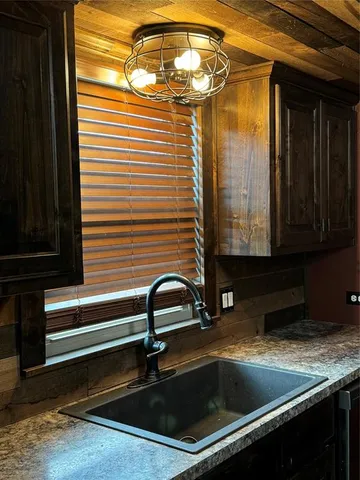 a bathroom with a sink and a window