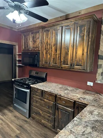 a kitchen with a stove and a microwave
