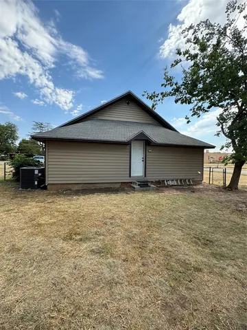 a house with trees in the background
