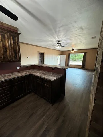 a kitchen with stainless steel appliances granite countertop a sink and stove